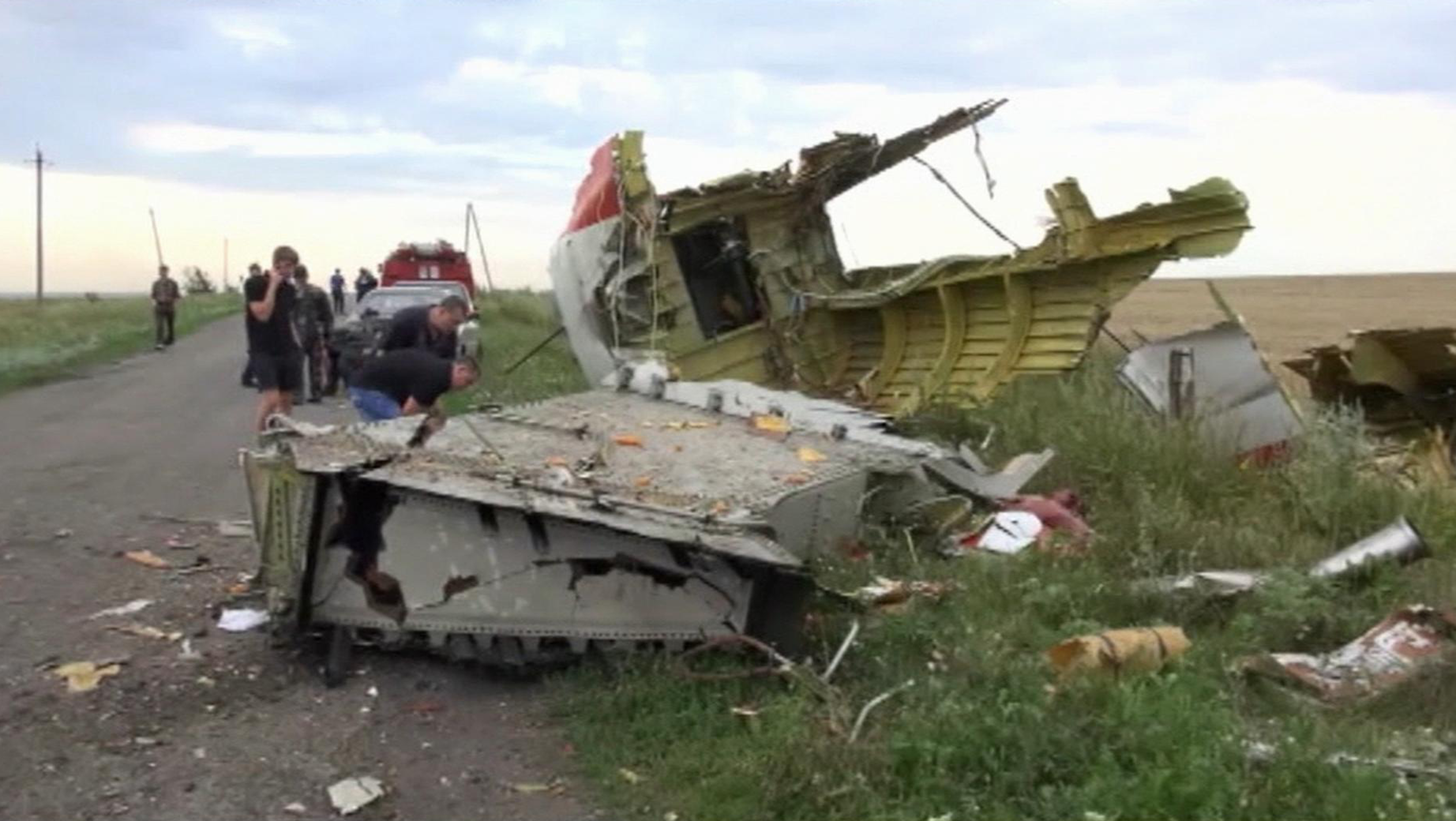 In this image taken from video, Thursday July 17, 2014, showing part of the wreckage of a passenger plane carrying 295 people after it was shot down Thursday as it flew over Ukraine, near the village of Hrabove, in eastern Ukraine. (Photo: In this image taken from video, Thursday July 17, 2014, showing part of the wreckage of a passenger plane carrying 295 people after it was shot down Thursday as it flew over Ukraine, near the village of Hrabove, in eastern Ukraine. (Photo: